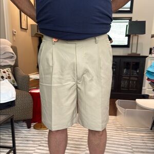 Men's khaki tan Daniel Cremieux signature front pleated.  9” inseam.